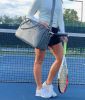 The LAVA medium tennis duffle bag is made of high quality pebble vegan leather; with separate key and bottle holders. Specially designed racquet pocke